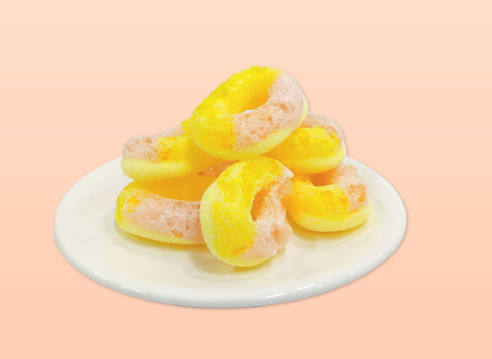 freeze dried circle candy with yellow peach flavor